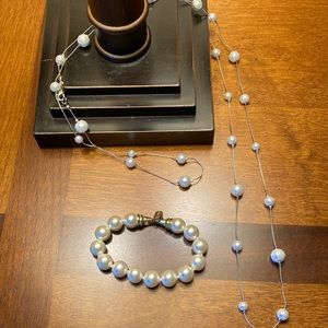 Long strand of faux pearls and faux pearl bracelet.